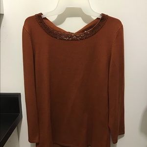 Sweater with beading.